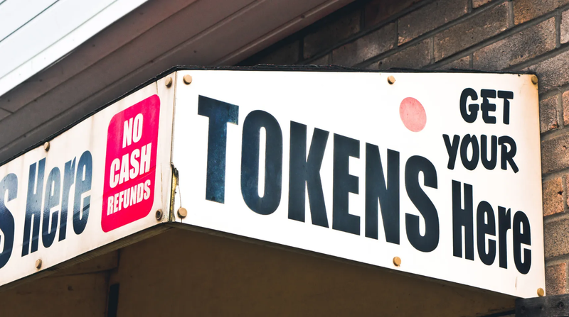 "Get your tokens here" sign