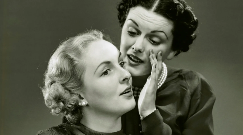 Two women gossiping