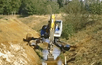 Excavator in a ditch