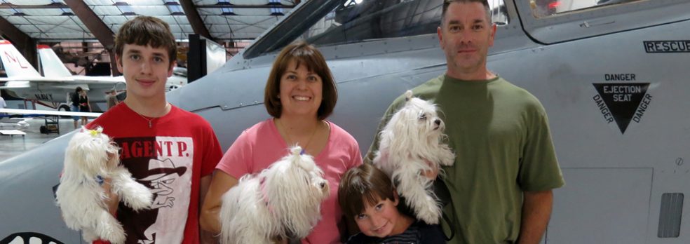 The Saunders family with their dogs at Pima Air and Space Museum near Tucson, Arizona