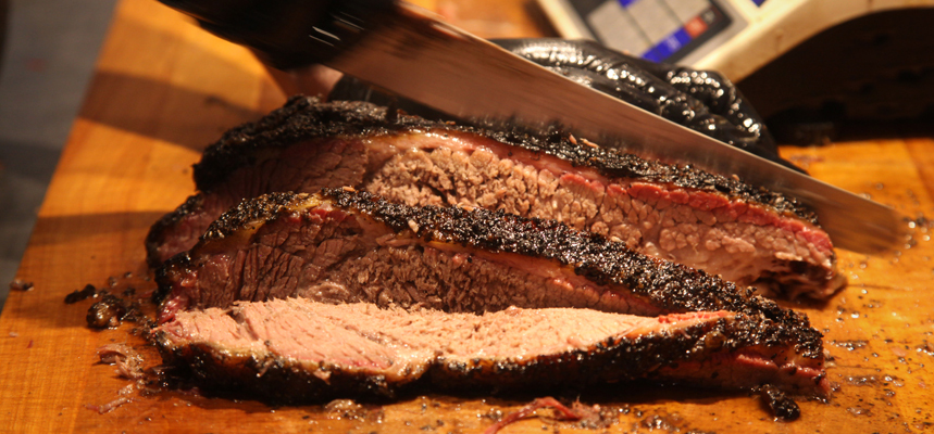 Prepared brisket gets sliced at Little Miss BBQ in Phoenix