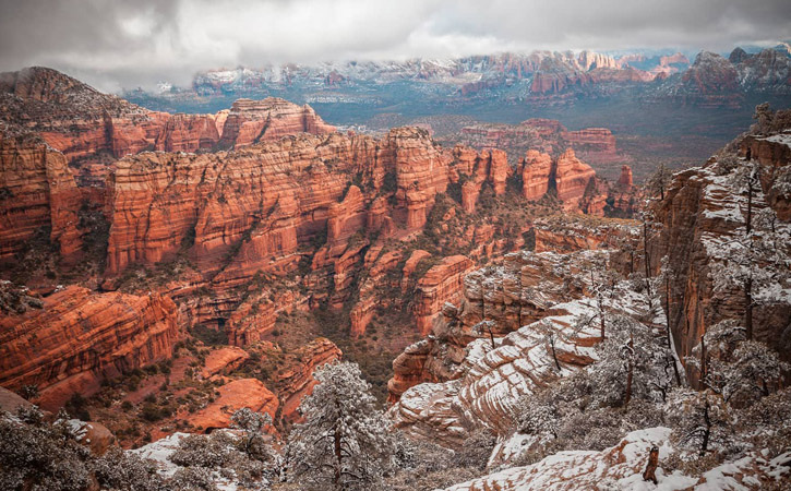 Bear Mountain's red rocks covered in snow during the day