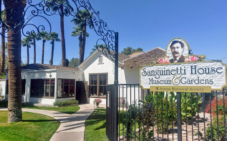 Entrance to a garden and historic home with a sign reading Sanguinetti House Museum and Gardens