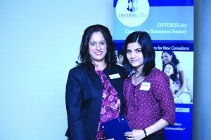 Sultanah Dada, the winner of the inaugural Maria Celaje Bursary, photographed here with Neelam Sahota, CEO of DIVERSEcity  Community Resources Society. 