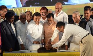 Lucknow: Uttar Pradesh Chief Minister Akhilesh Yadav cuts a cake during a programme organised by his supporters and Samajwadi Party (SP) workers to celebrated his 43rd birthday in Lucknow on July 1, 2015. (Photo: IANS)