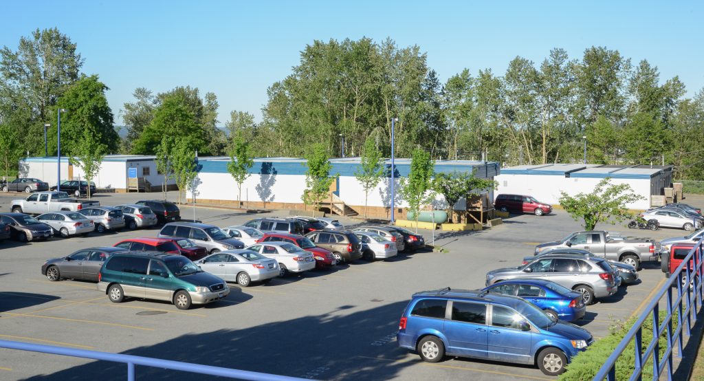 Lord Tweedsmuir Secondary has a parking lot full of portables. Photo: Ray Hudson