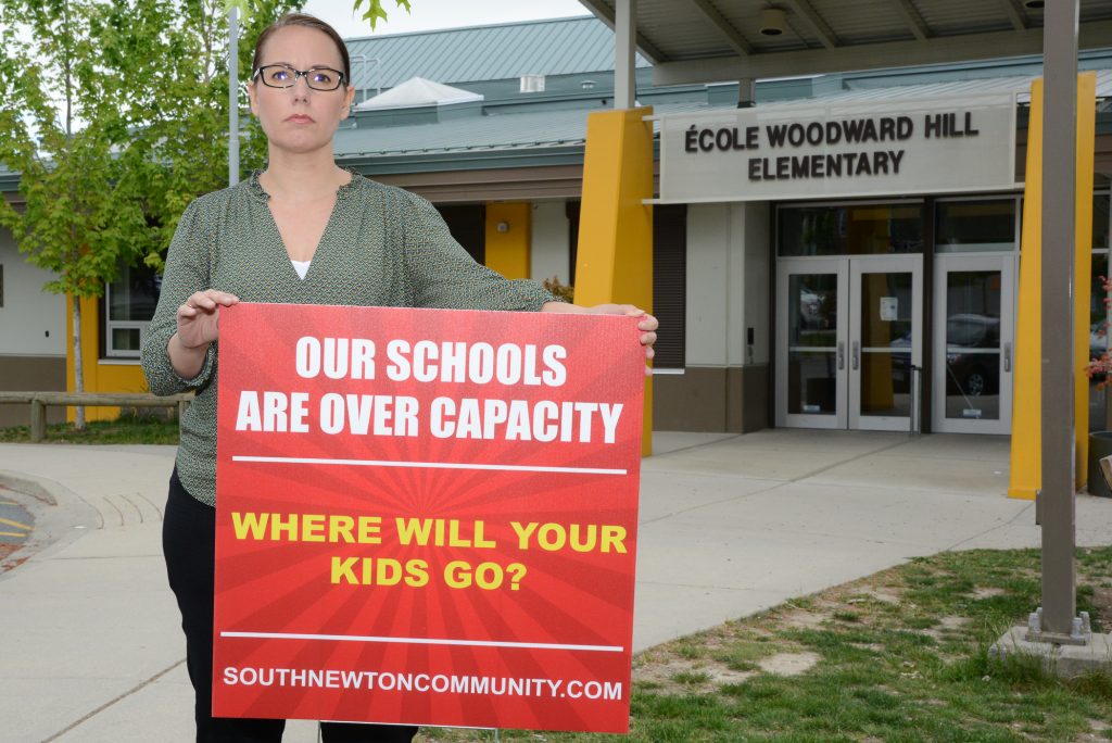 Cindy Dalglish, one of the leaders of the South Newton Community, makes her point in front of her daughter’s school where some French Immersion classes may be relocated due to crowding, and before Mayor and Council last Monday evening. Photos: Ray Hudson