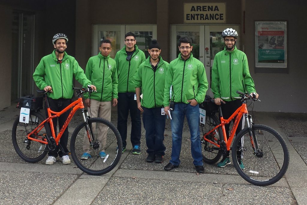 Volunteers pose with their bikes at the Newton Arena.  Photo: Ray Hudson