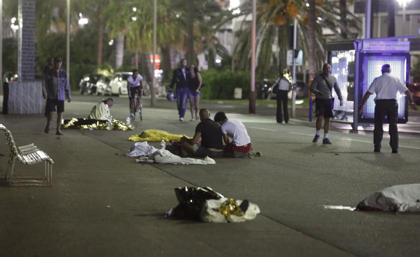 Bodies are seen on the ground after at least 30 people were killed in the southern French town of Nice when a truck ran into a crowd celebrating the Bastille Day national holiday