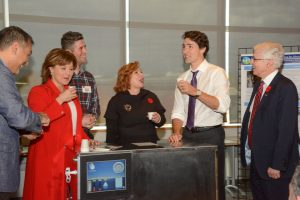 Hybrid Atmospheric Water Generator, which will pull potable water from the atmosphere anywhere there is air. Here, demod Prof. Majid Bahrami, Premier Christy Clark, PhD student Farshid Bagheri co-developer, Mayor Linda Hepner, Prime Minister Justin Trudeau and SFU President Andrew Petter.  Photos: Ray Hudson