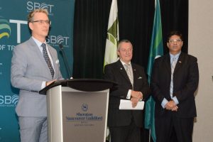 SBOT Chair Dr. Greg Thomas introduces TransLink Minister Peter Fassbender and Councillor Tom Gill.