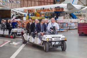 Amrik Virk, Technology, Innovation and Citizens' Service Minister touring the Boeing plant. (driving is a Boeing employee); second row (left) is Roberto Valla, Vice President, Global Sales – Canada, Boeing Defense, Space, & Security (BDS) and beside him, John Jacobson, Virk’s Deputy Minister; third row (first car) is Fadi Deek, Director, Business Engagement, Boeing Vancouver.