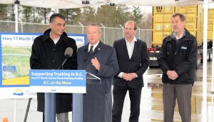 Provincial Ministers and Surrey MLAs Amrik Virk and Peter Fassbender, announce the new truck parking facility with BCTA Vie Chair Ken Johnson and Murray Scadeng of Triton Trucking looking on. Photo: Ray Hudson