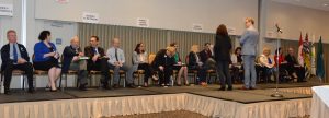 Candidates in the provincial election are briefed prior to the presentation, by moderator, Dr. Greg Thomas, Chair of the SBOT and Anne Peterson, the Time Keeper.    