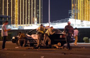 LAS VEGAS, NV - OCTOBER 01:   Las Vegas police stand guard along the streets outside the the Route 91 Harvest country music festival grounds after a active shooter was reported on October 1, 2017 in Las Vegas, Nevada. There are reports of an active shooter around the Mandalay Bay Resort and Casino.  (Photo by David Becker/Getty Images) ORG XMIT: 775052817