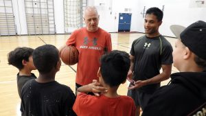 Cst. John Wilson and Big Brothers mentor talk with students as part of Game On! Initiative.