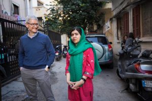 Tim Cook and Malala Yousafzai outside the home of a family with daughters attending school in Beirut, Lebanon supported by Malala Fund. (Photo: Apple)