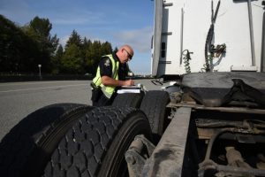 Cst. Usipiuk writes a ticket during the commercial vehicle enforcement blitz.