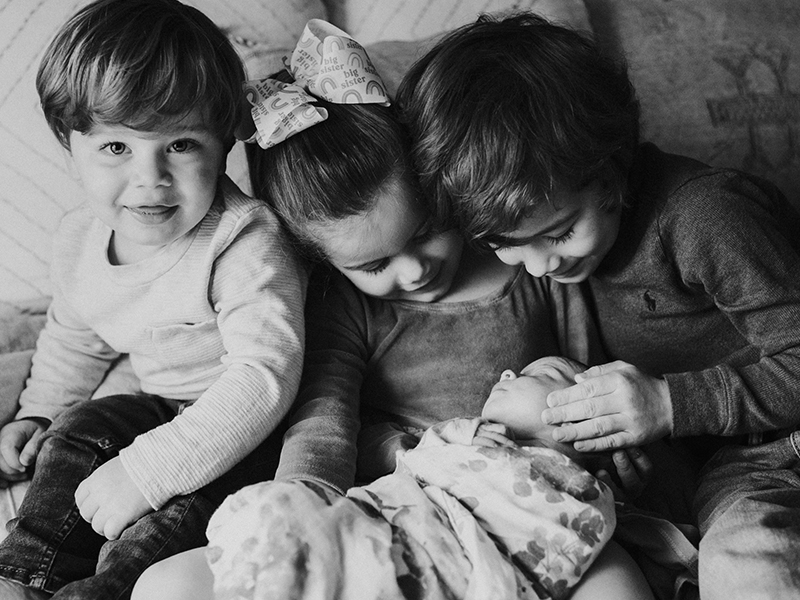 Newborn baby with siblings