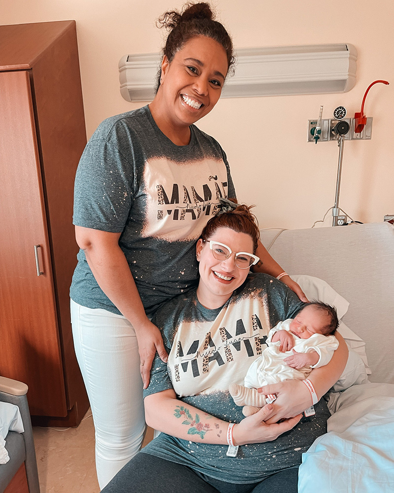 Melanie and Jordana at the hospital with their newborn Niccolo