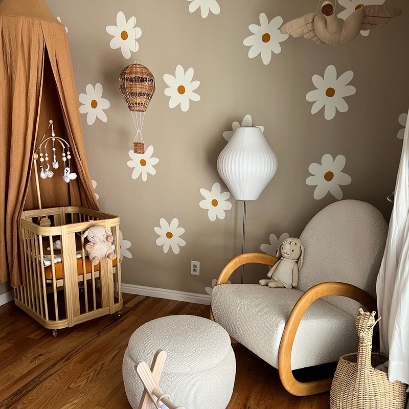 Nursery with daisy wallpaper