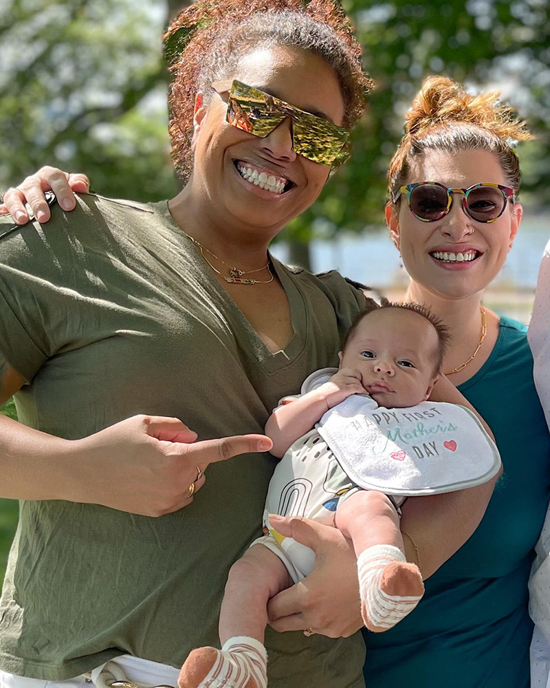 Melanie and Jordana holding their baby son Niccolo