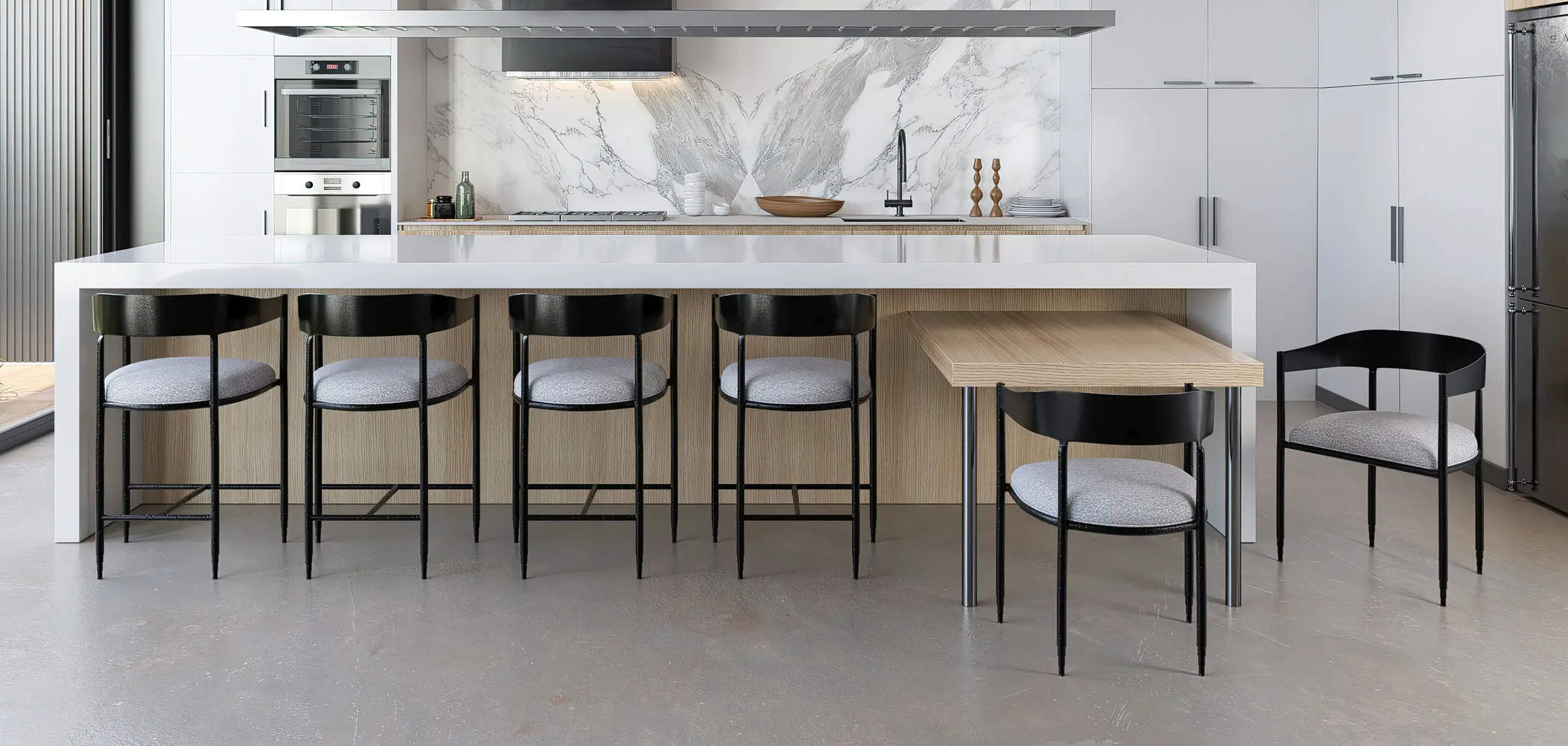 Lorenzo barstools & chairs shown in Hand Hammered Black finish with Zen Dawn Performance fabric. Shown in a modern white & grey kitchen with warm wood accents.
