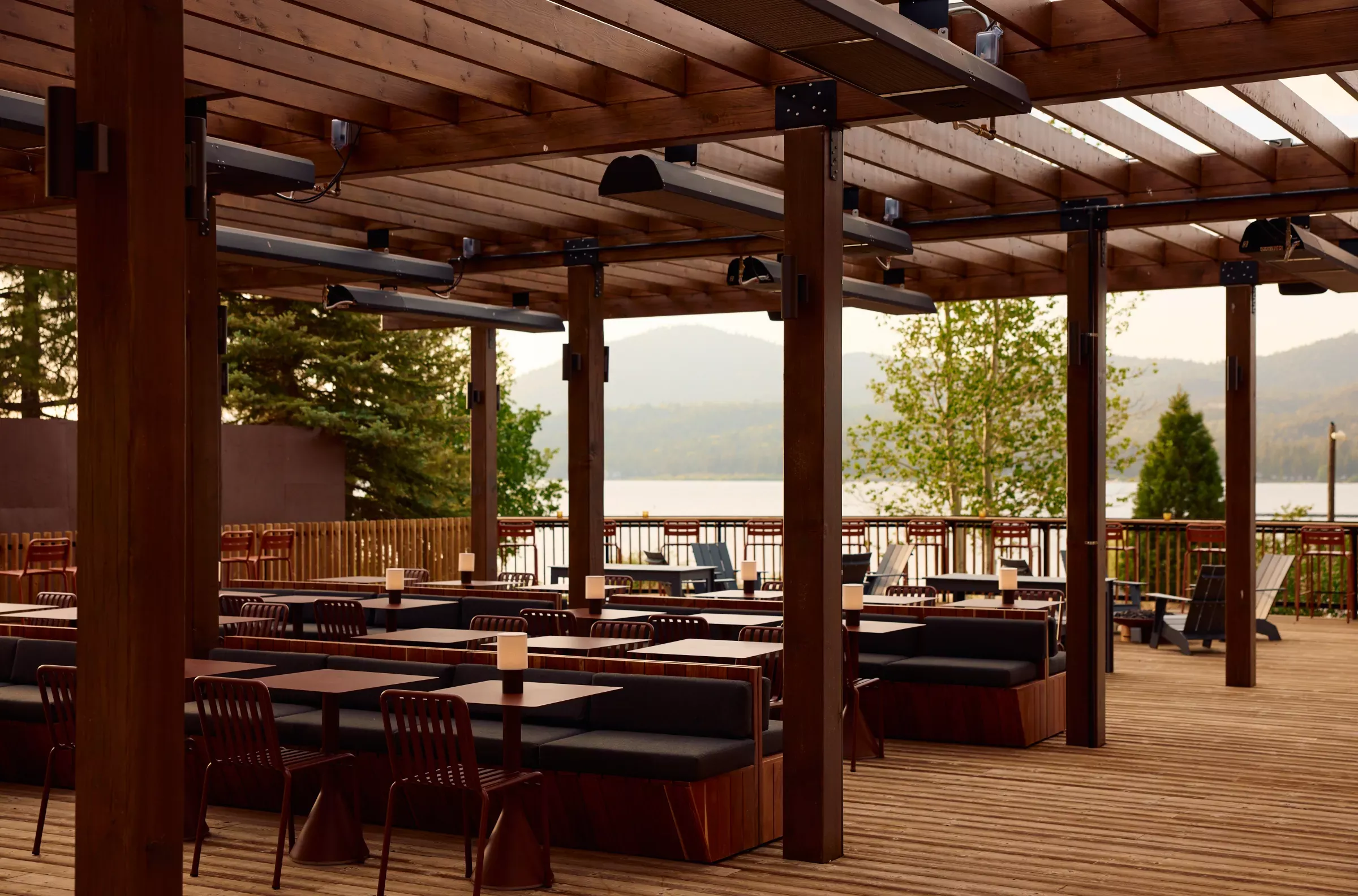 A photo of the deck view at Hotel Marina Riviera, in the background Big Bear Lake is visible with a semi-thick fog.