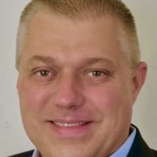 Marius Domokos, Esq.