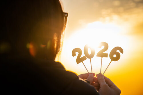 Ethnic woman looking at 2026 decor while watching sunset