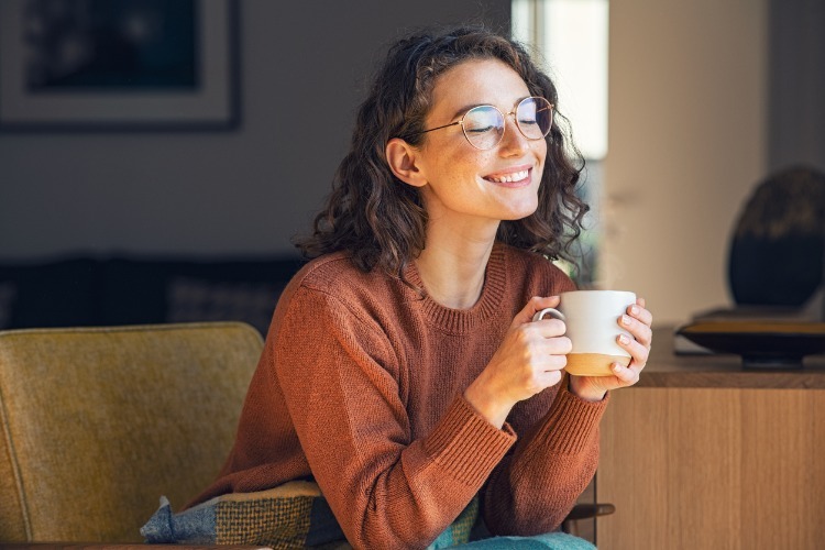 Beautiful woman relaxing and drinking hot tea picture id1326419180