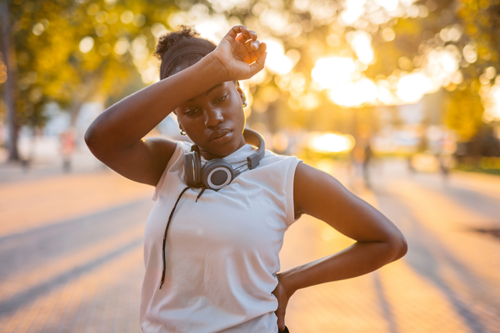 Picture of a young black woman post jog wondering why theres no runners high