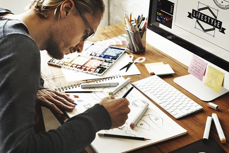 Creative Man Working On Designs