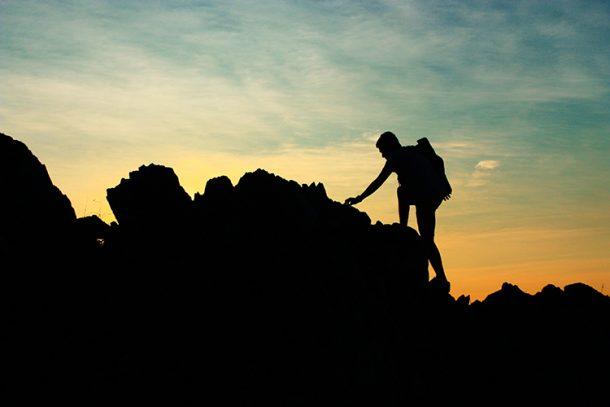 Man Climbing Mountain