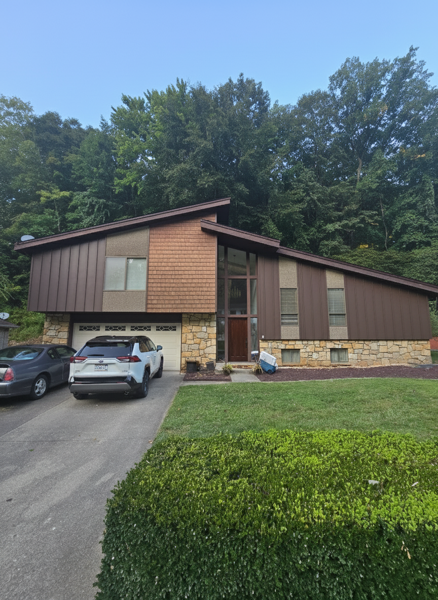 After - exterior transformation: Update the siding and use colors that complement the door and stone