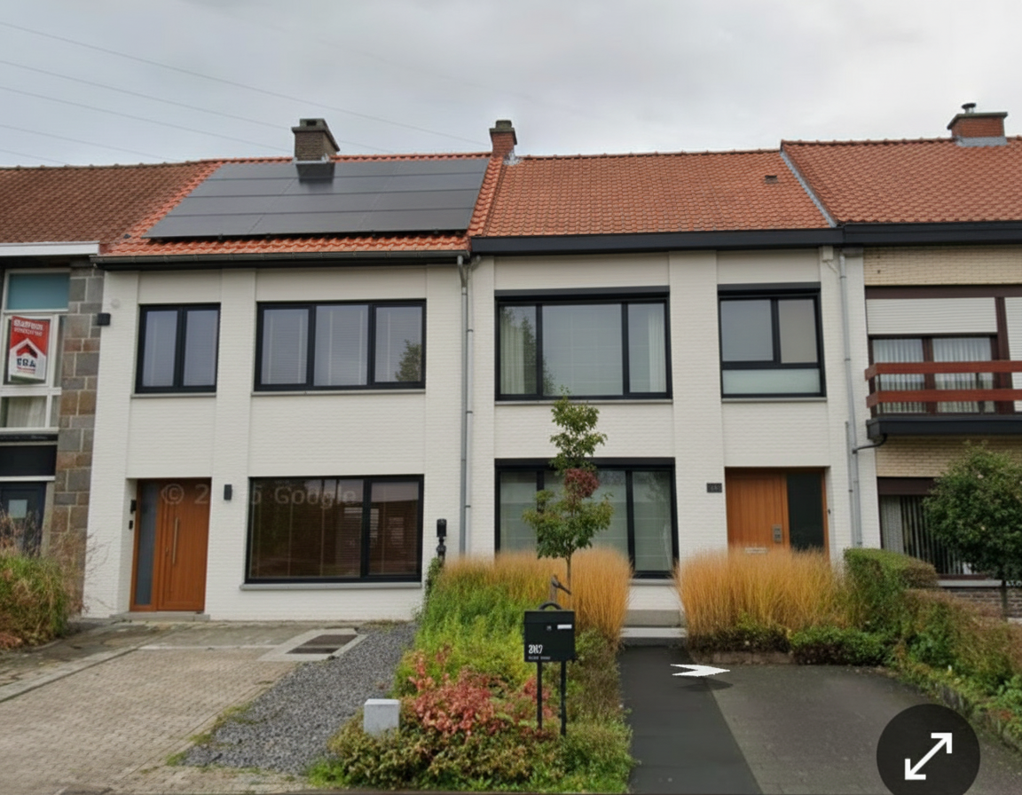 After - exterior transformation: Paint the bricks in the two middle houses white with a cream undertone. Paint the windowframes black and leave the front door unchanged. Leave the roof with solar panels the same but clean the roof of the other house.