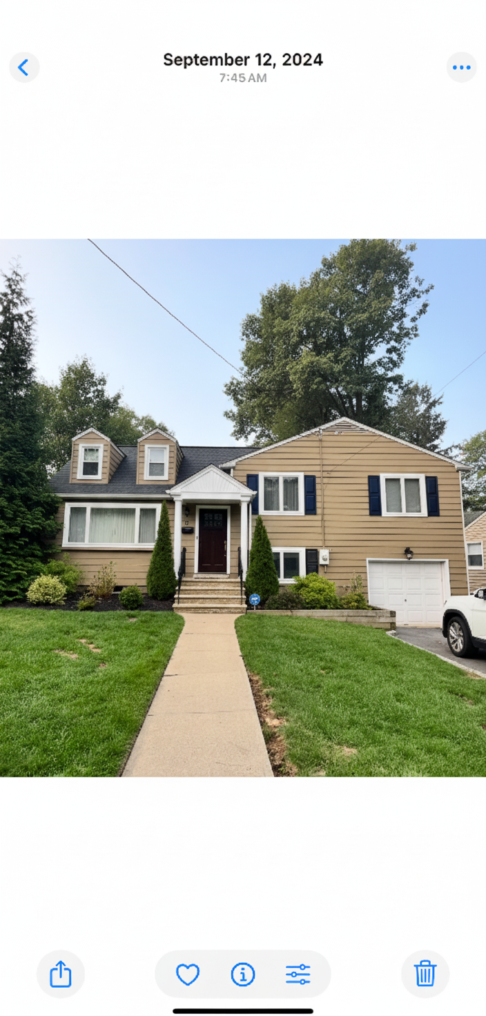 After - interior transformation: Make the house light greige (warm tone) with navy shutters a portico and dormers on the left side. Redesign the portico to be nicer. Prettier front door.