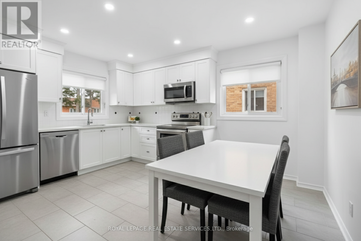 After - interior transformation: Design type: interior. Style Ref: None. Instructions: renovate this kitchen with potlights, new cabinets, white in color, change flooring, applicances, show new design
