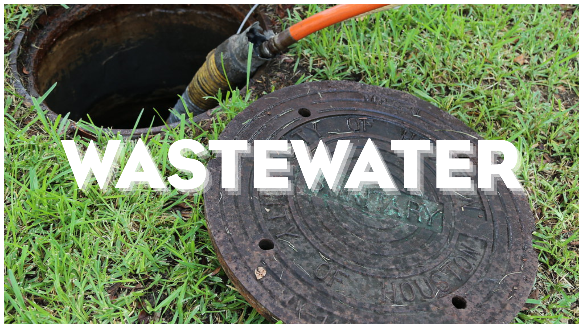 Wastewater maintenance image showing an open manhole and equipment near a City of Houston sewer cover.