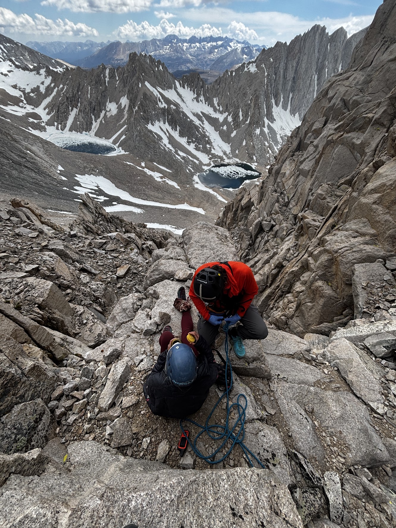 patient and rescuer with view of mt williamson basin and jagged peaks in the background