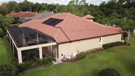 exterior house painting with spray gun