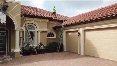 exterior house painting with red roof
