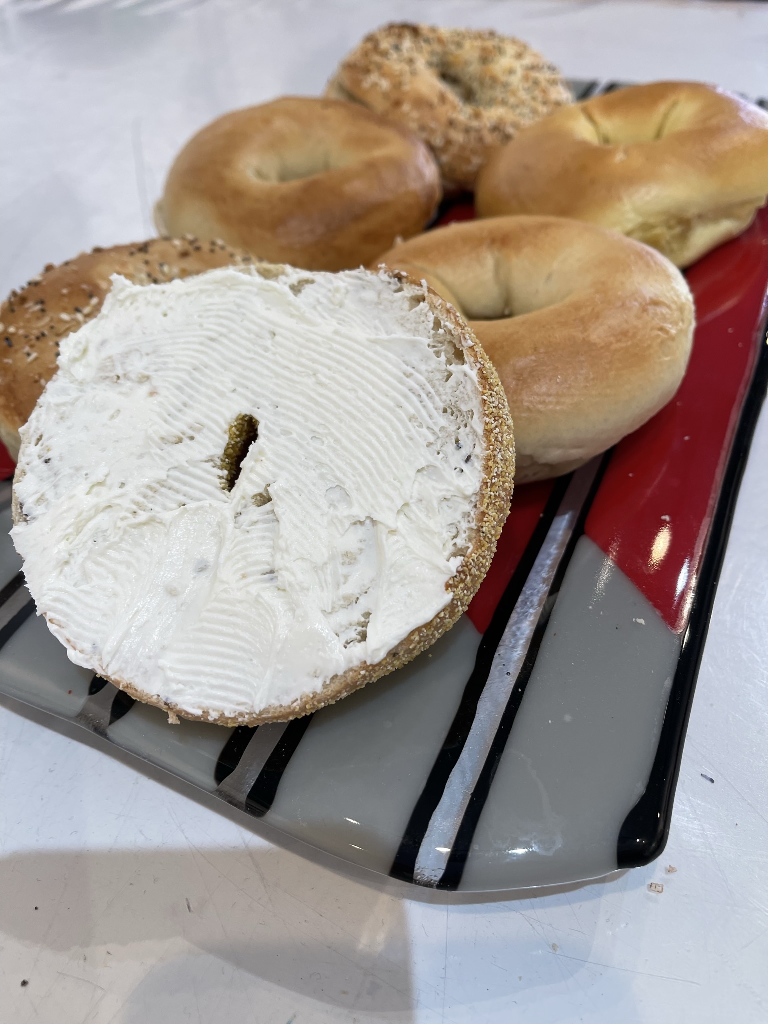 Tray serving bagels always a crowd pleaser.