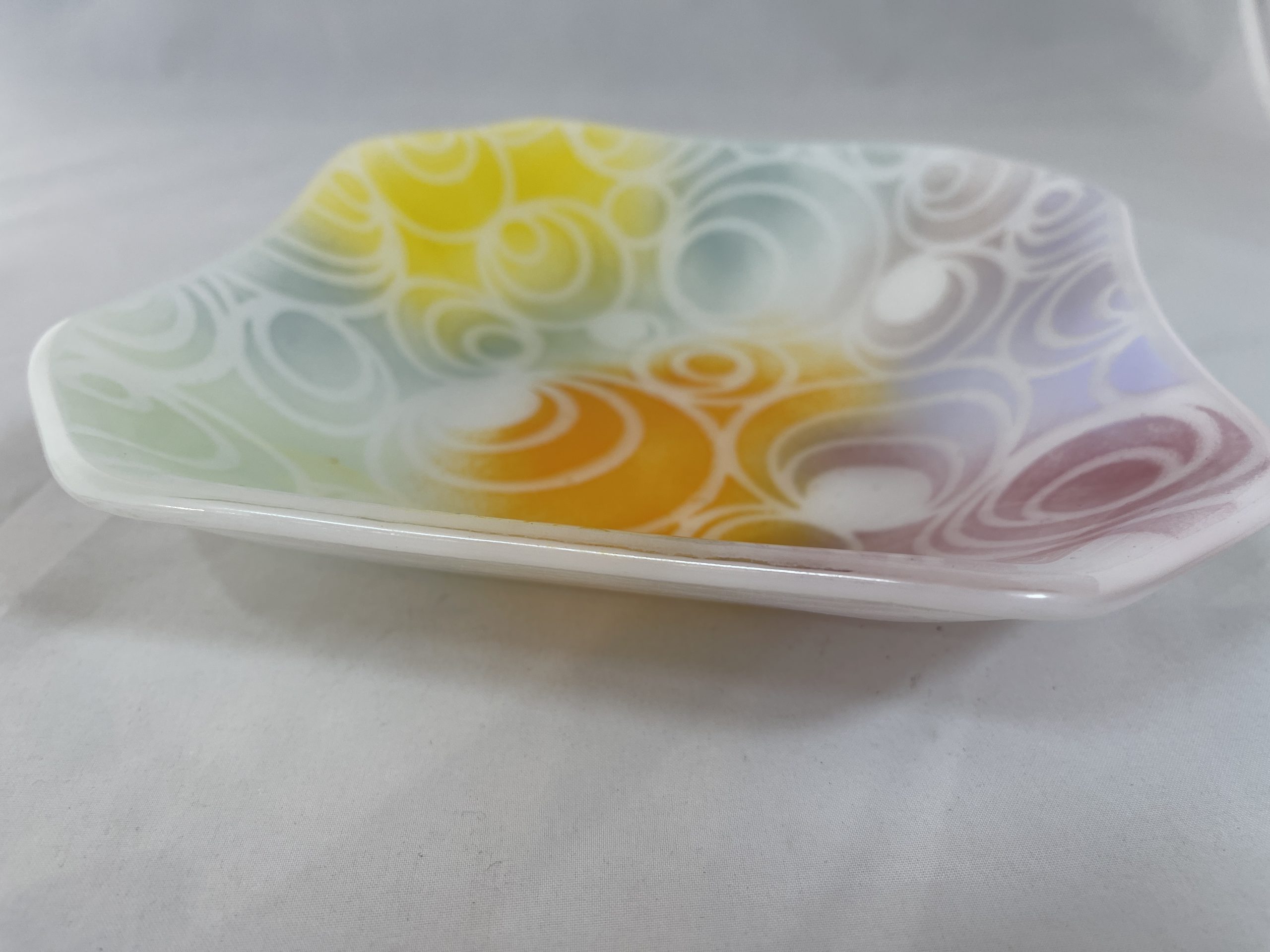 Square platter with pastel colors and circle designs