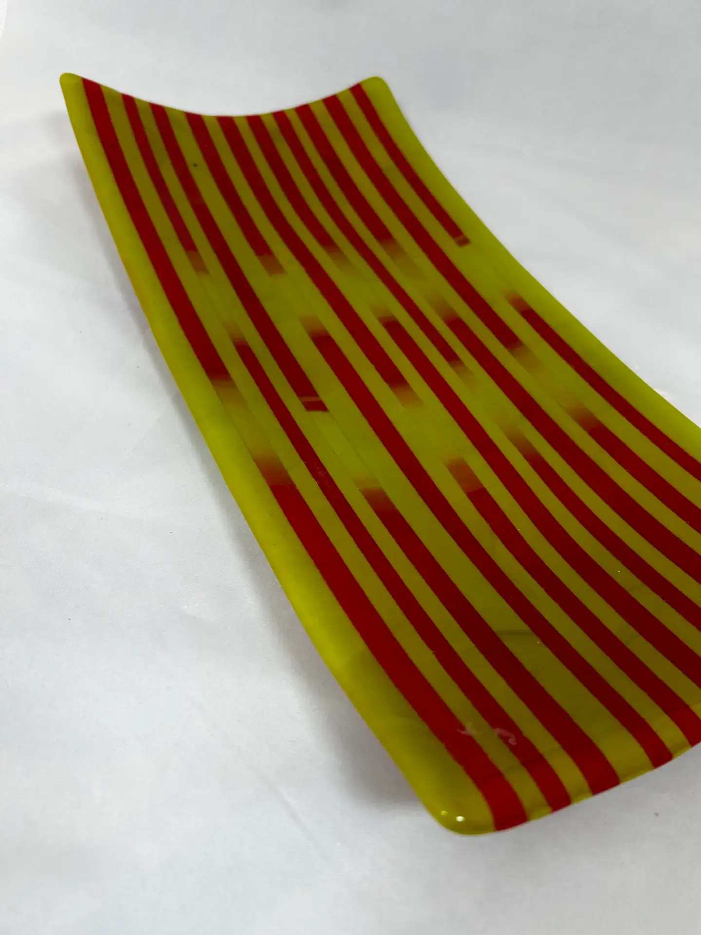 Detail view of alternating red and yellow bands in Vibrant Stripes