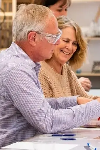 Couple creating fused glass art at Glass Arts Collective