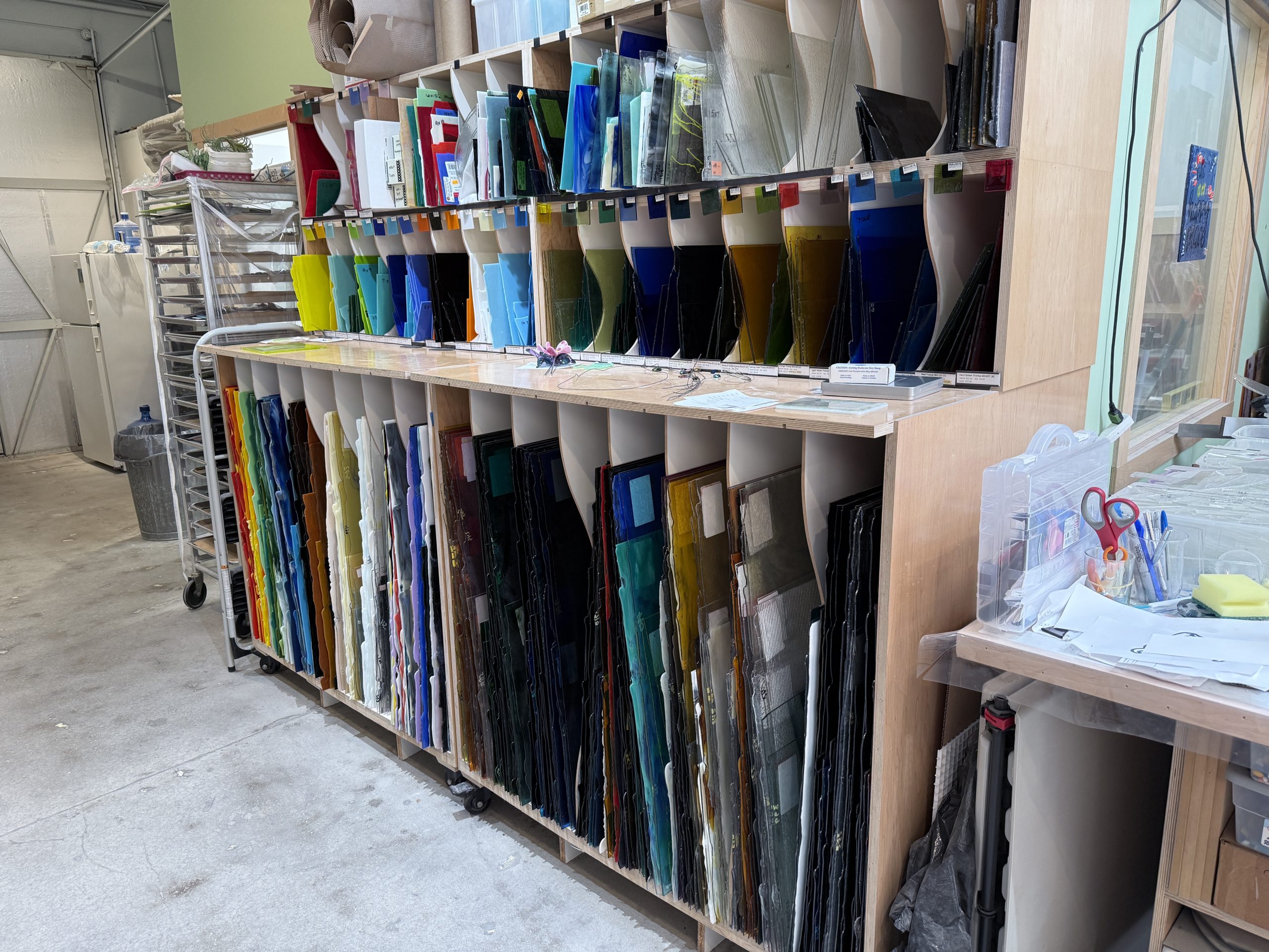 Rack of sheets of Bullseye Glass available for sale