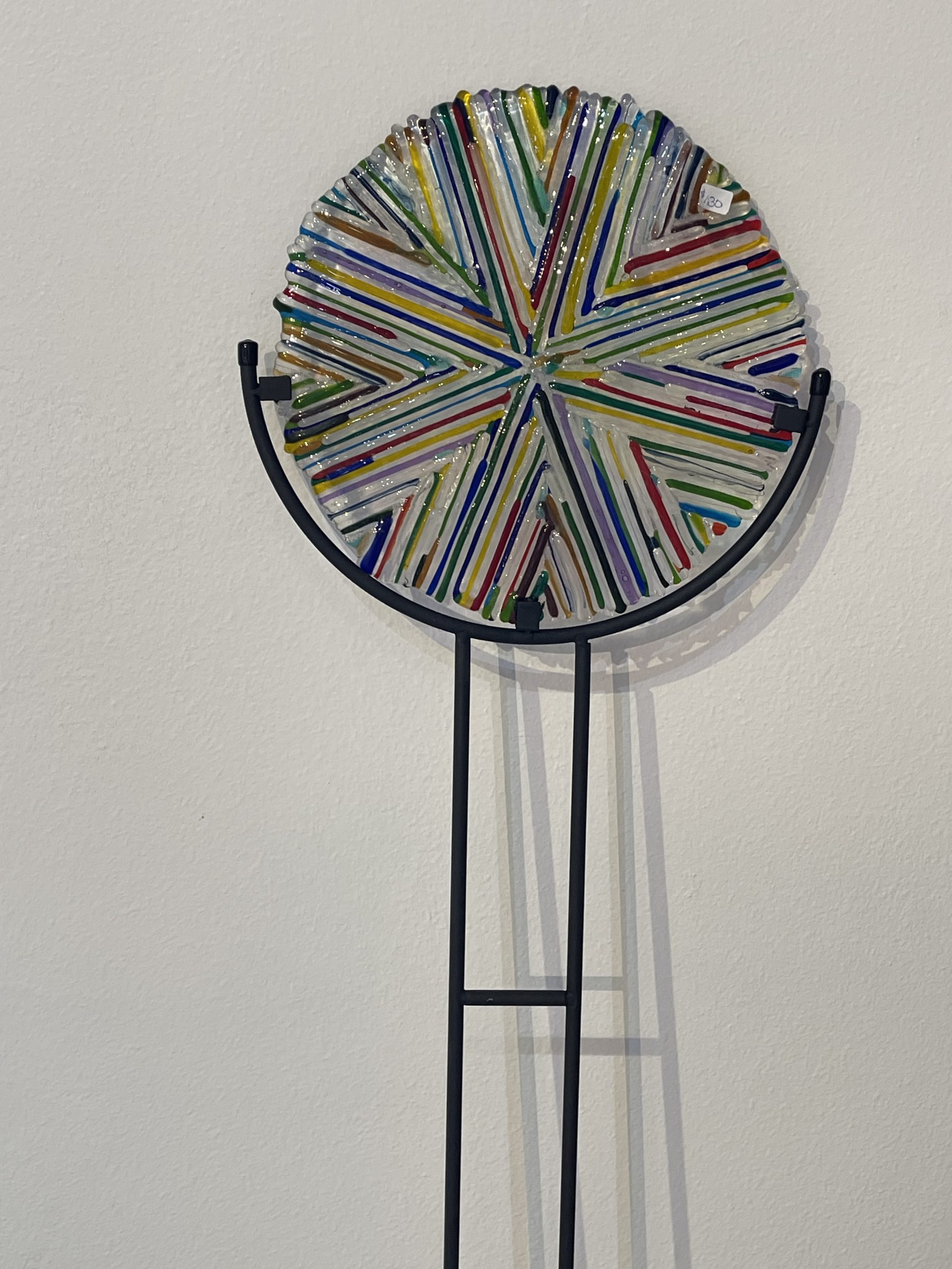 Detail view of colorful kiln-fused glass in Kaleidoscope Bloom