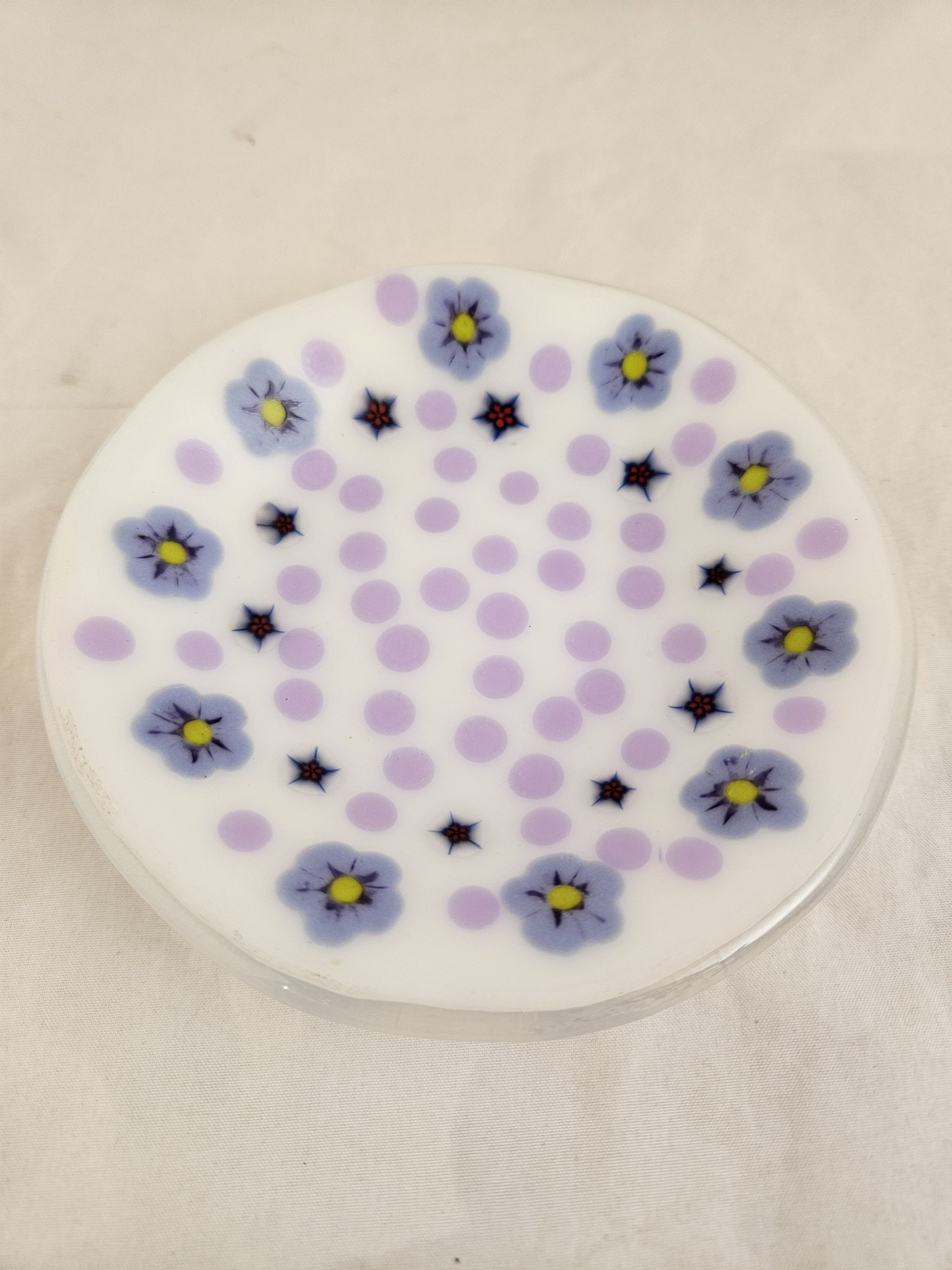 Detail view of lavender dots and floral forms in Petal Scatter