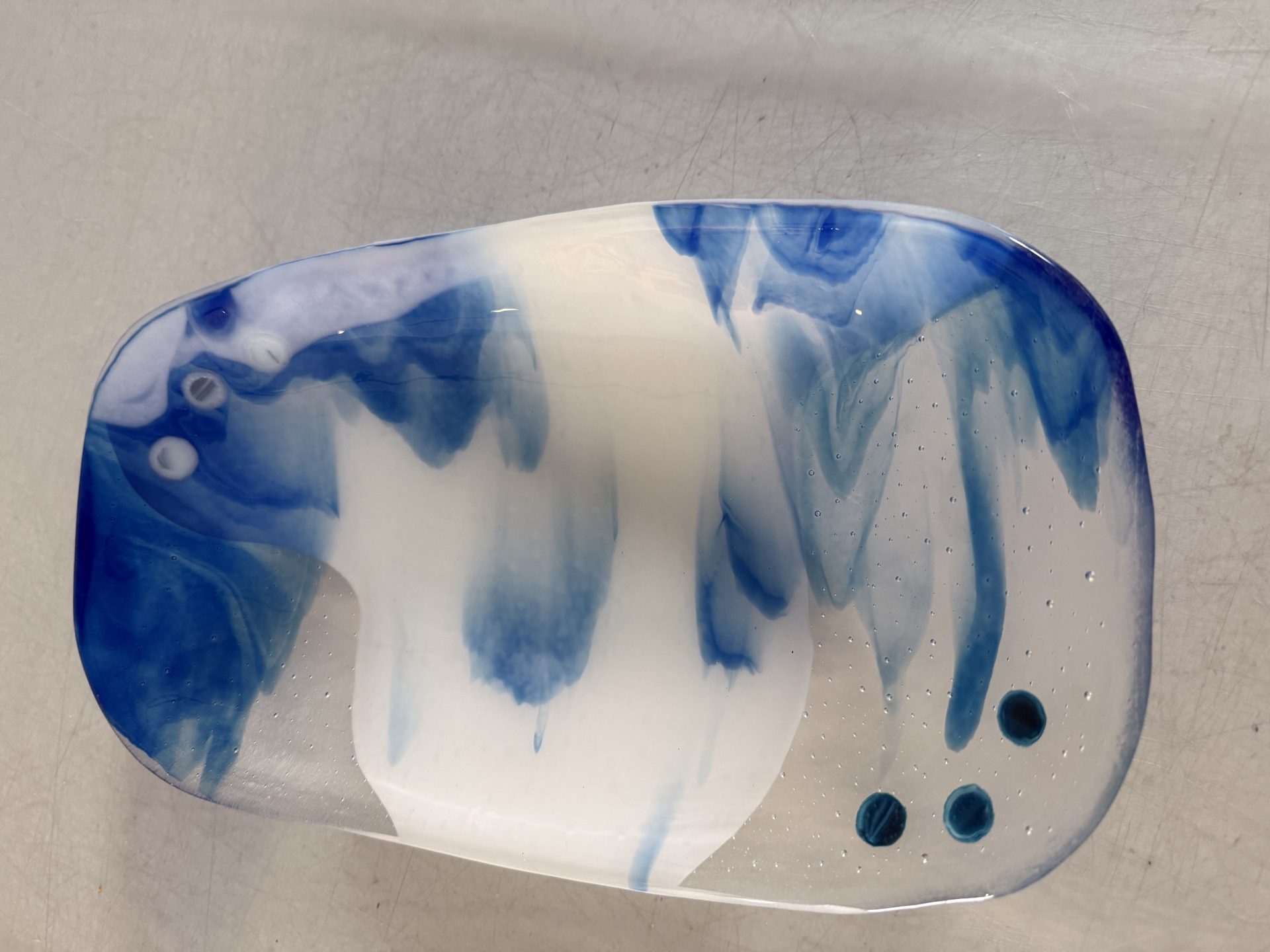 Close-up of blue and white fused glass detail on Blue Drift serving bowl